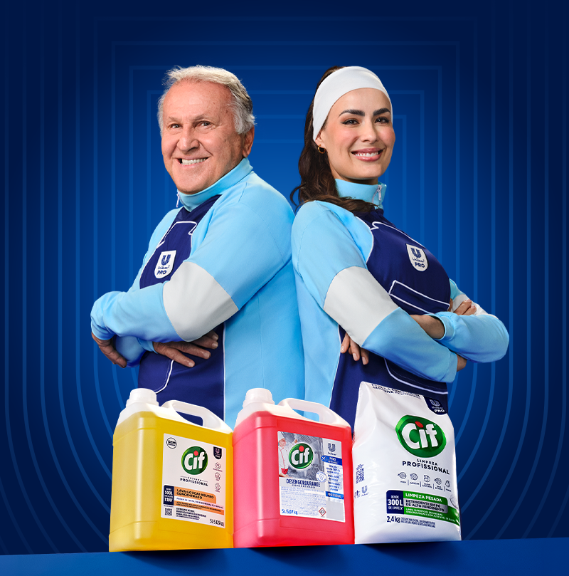 Smiling man and woman in blue tops pose with Cif cleaning products (yellow bottle, red bottle, white bag) on a blue background.