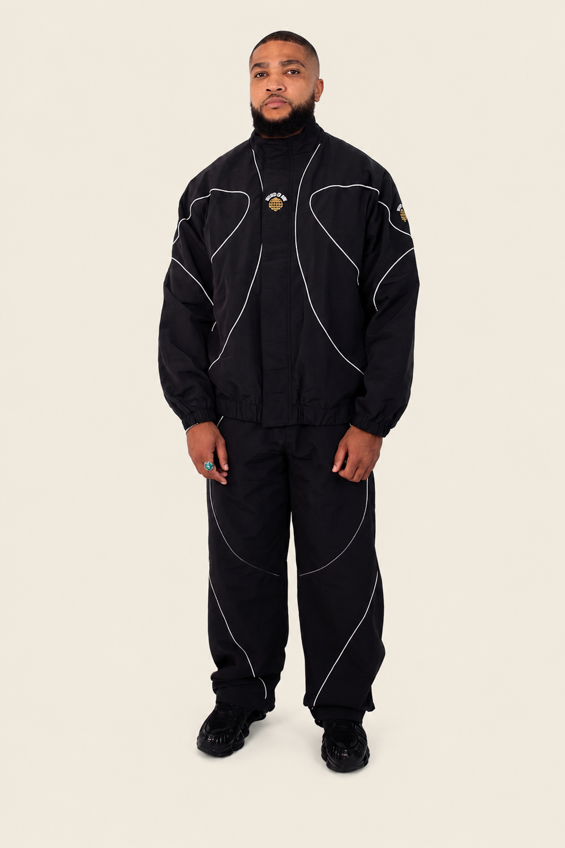 Model wearing black BOW tracksuit