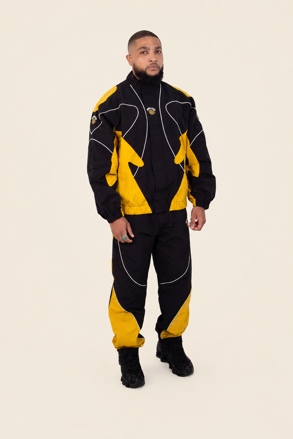 Model wearing black and yellow BOW tracksuit (Signal)