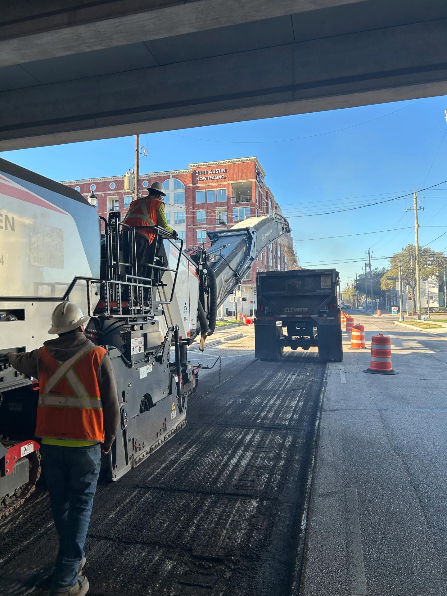 AAA Paving dump truck hauling material on a Houston commercial paving project