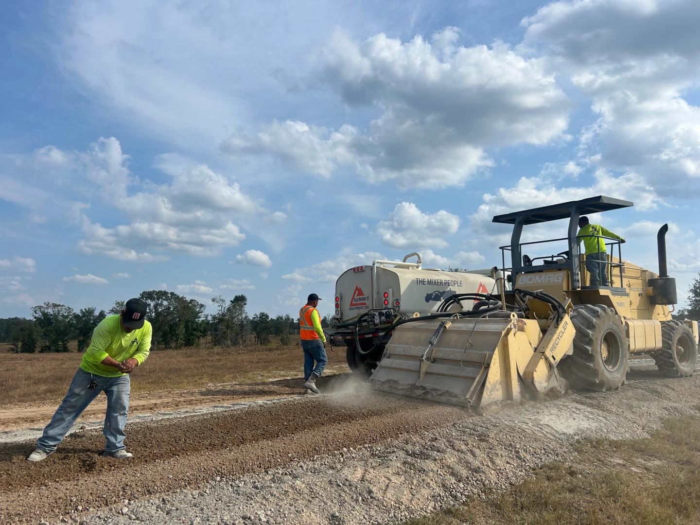 AAA Paving crew finishing a large commercial paving project in the Katy, TX area