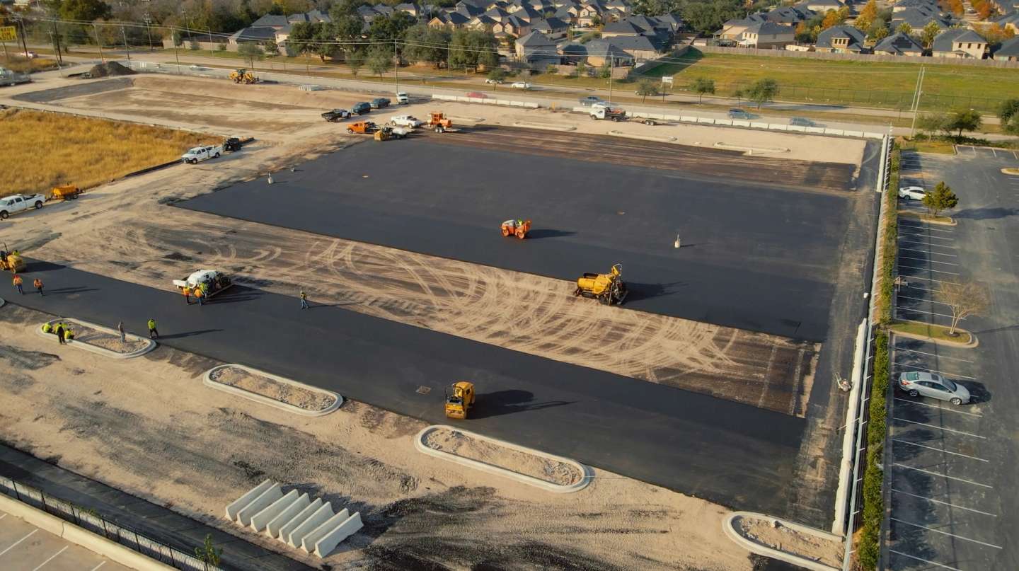 AAA Paving crew finishing a large commercial paving project in the Sugar Land, TX area