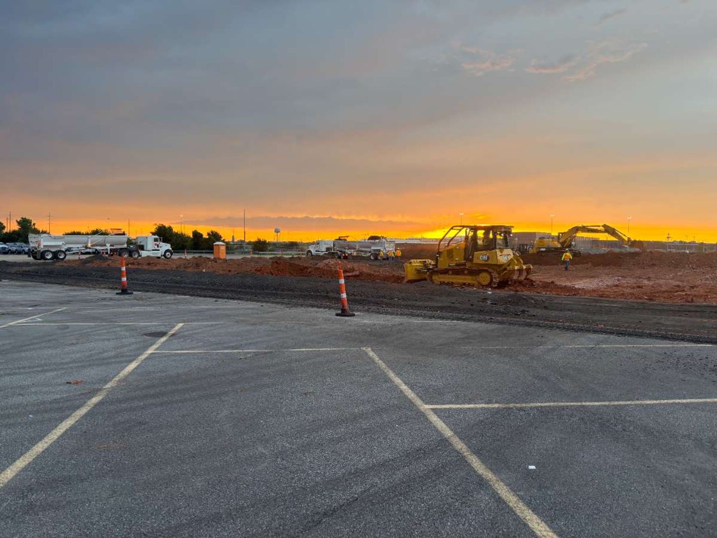 AAA Paving grading and preparing a commercial subgrade at sunrise