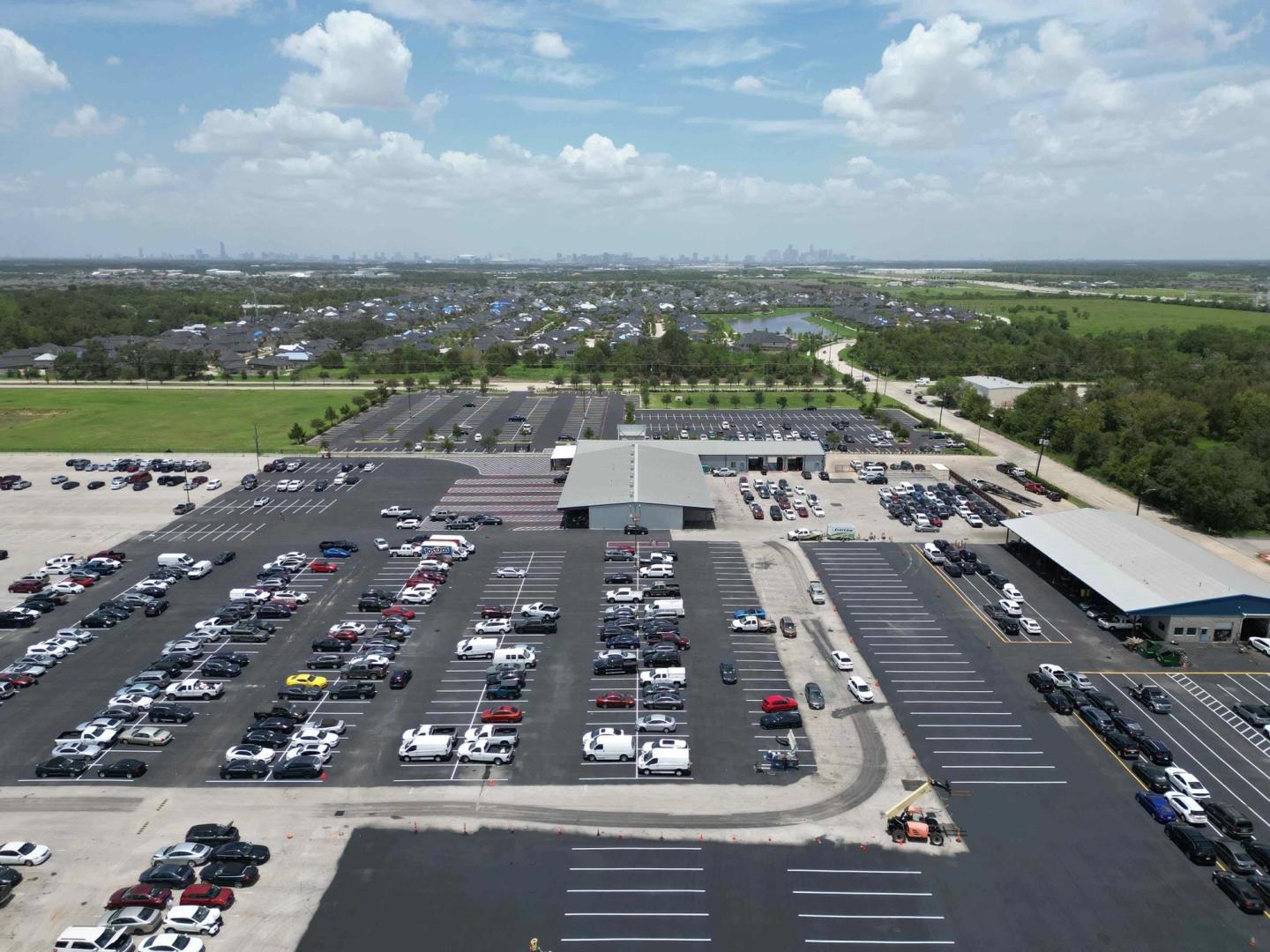 AAA Paving crew finishing a large commercial paving project in the Houston, TX area
