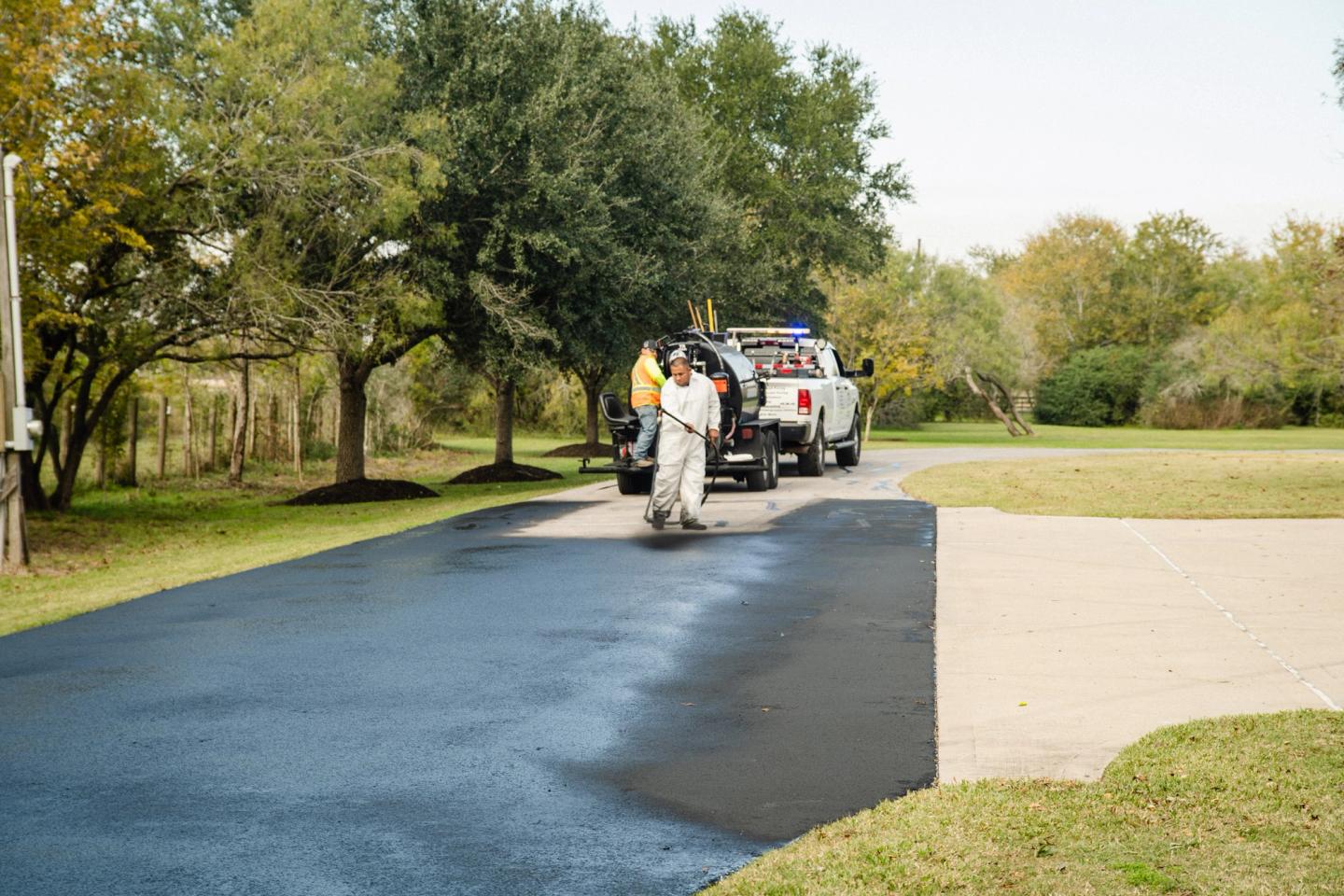 AAA Paving crew finishing a large commercial paving project in the The Woodlands, TX area