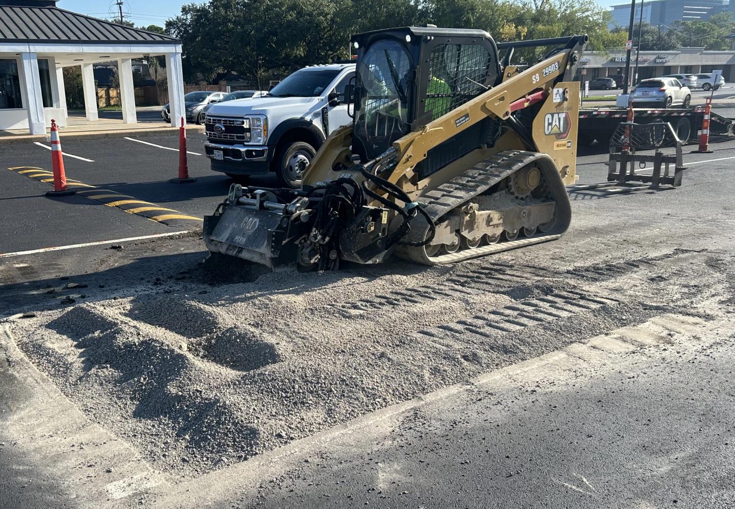Two AAA Paving rollers compacting a fresh asphalt mat
