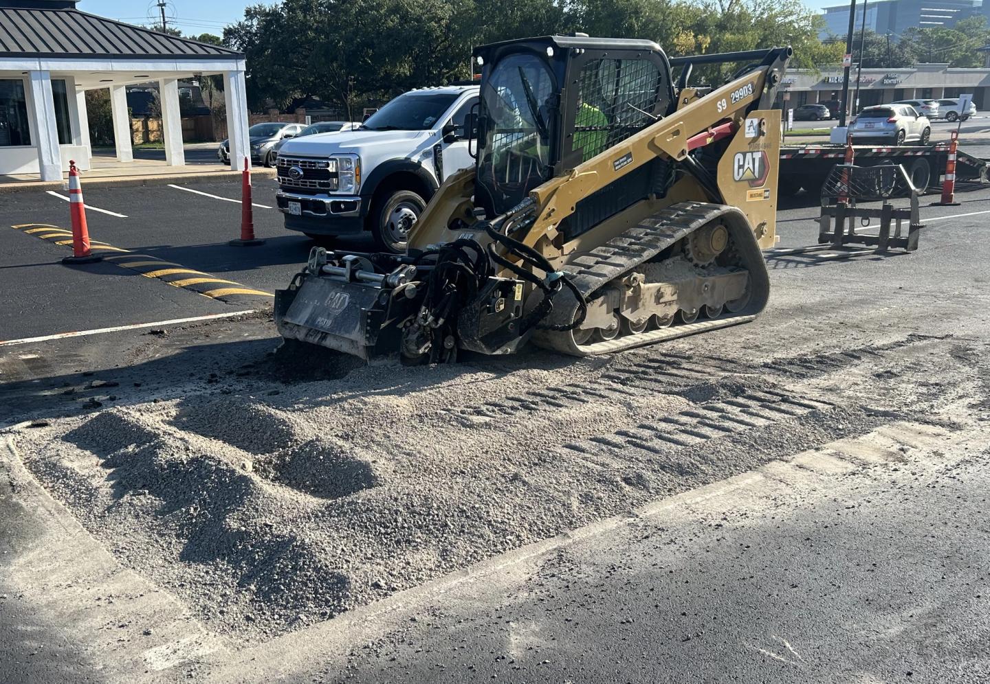 Two AAA Paving rollers compacting a fresh asphalt mat