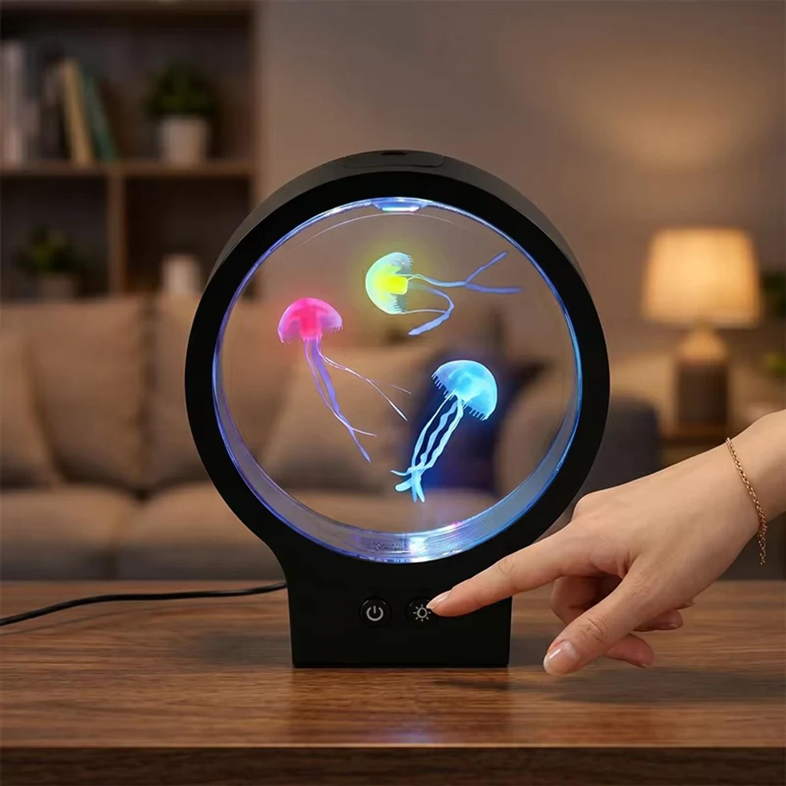Button controlled round aquarium night light with floating jellyfish visual effect