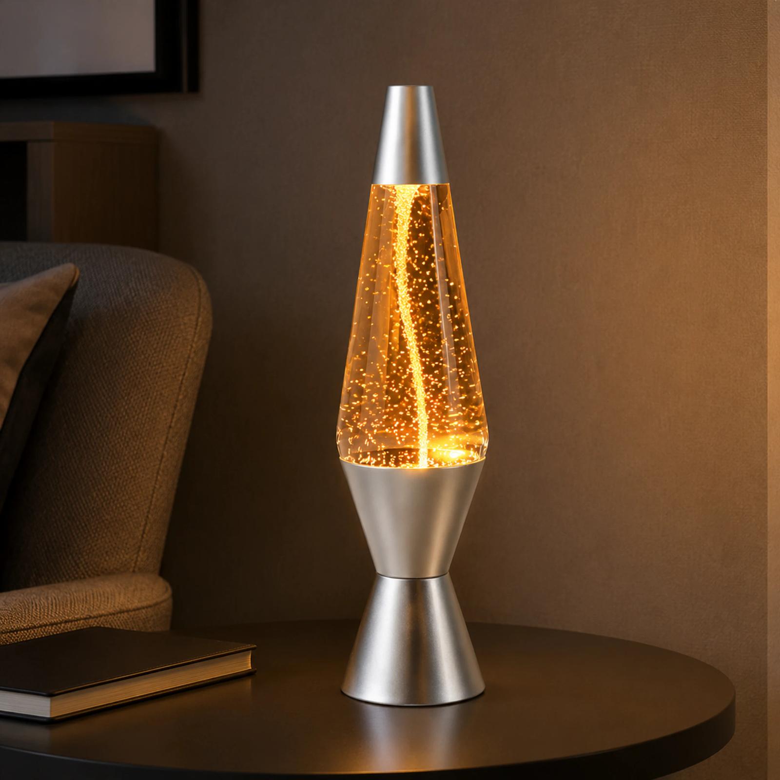 MX-3027T water vortex glitter lamp glowing amber beside a reading chair
