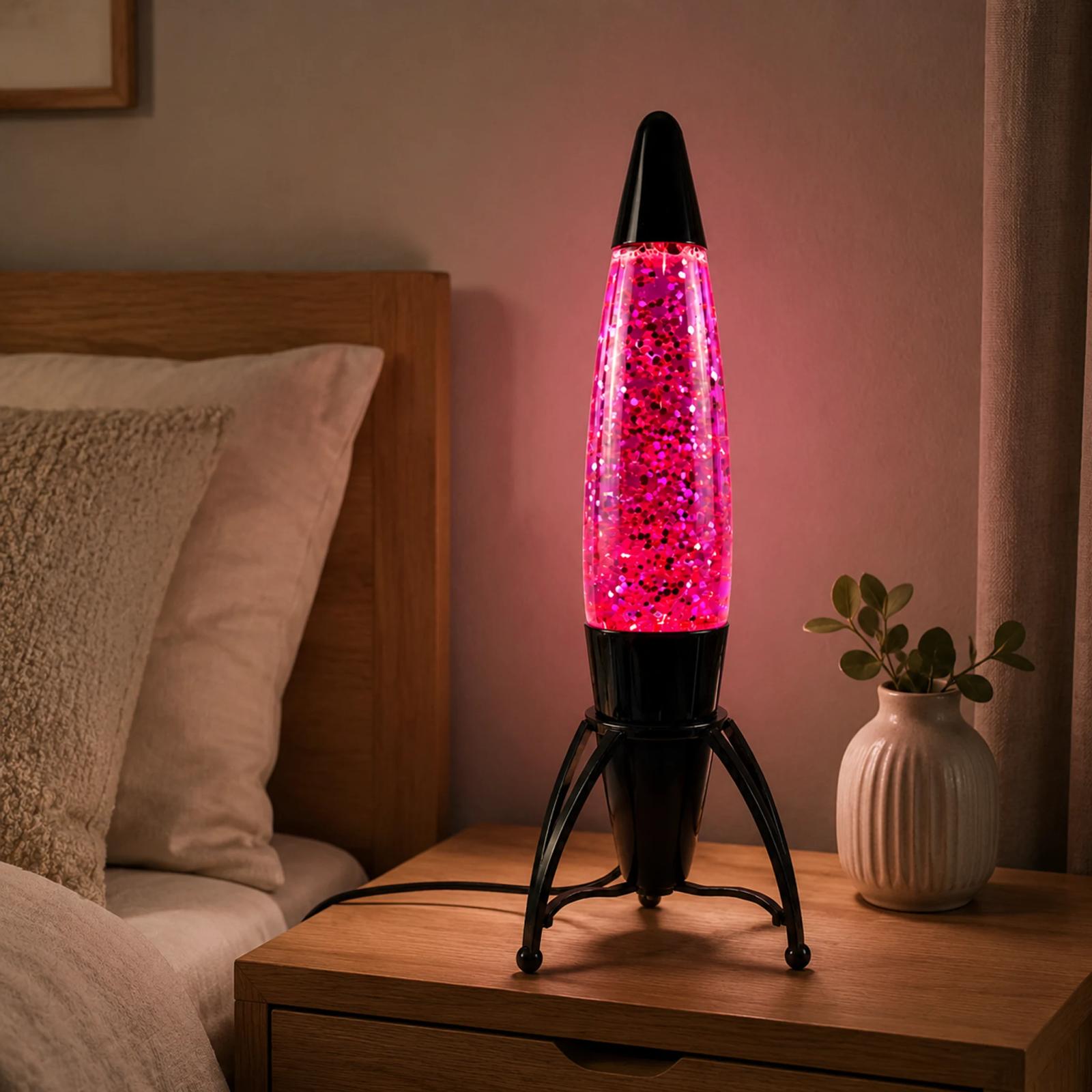 Pink MX-3060 rocket glitter lamp on a modern bedroom side table