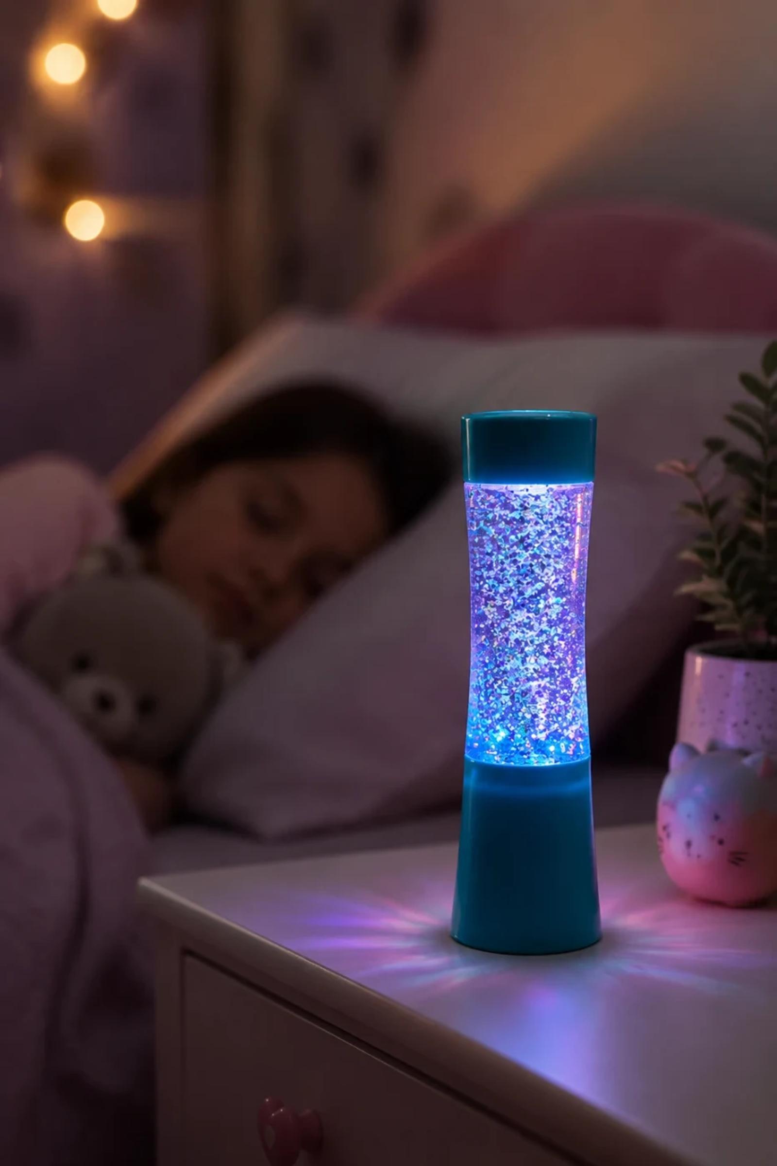MX-2014 mini glitter night light used on a bedside table in a kids bedroom scene.