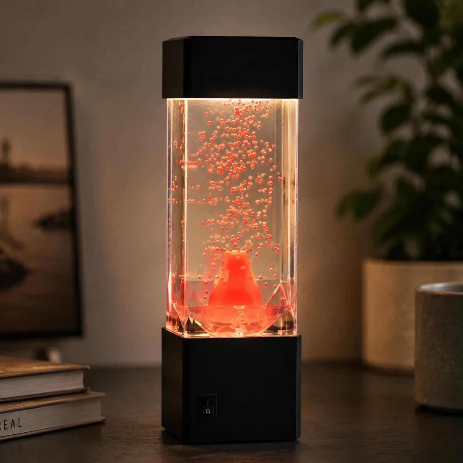 MX-5016 red bubble volcano LED night light with warm glowing effect on a table.