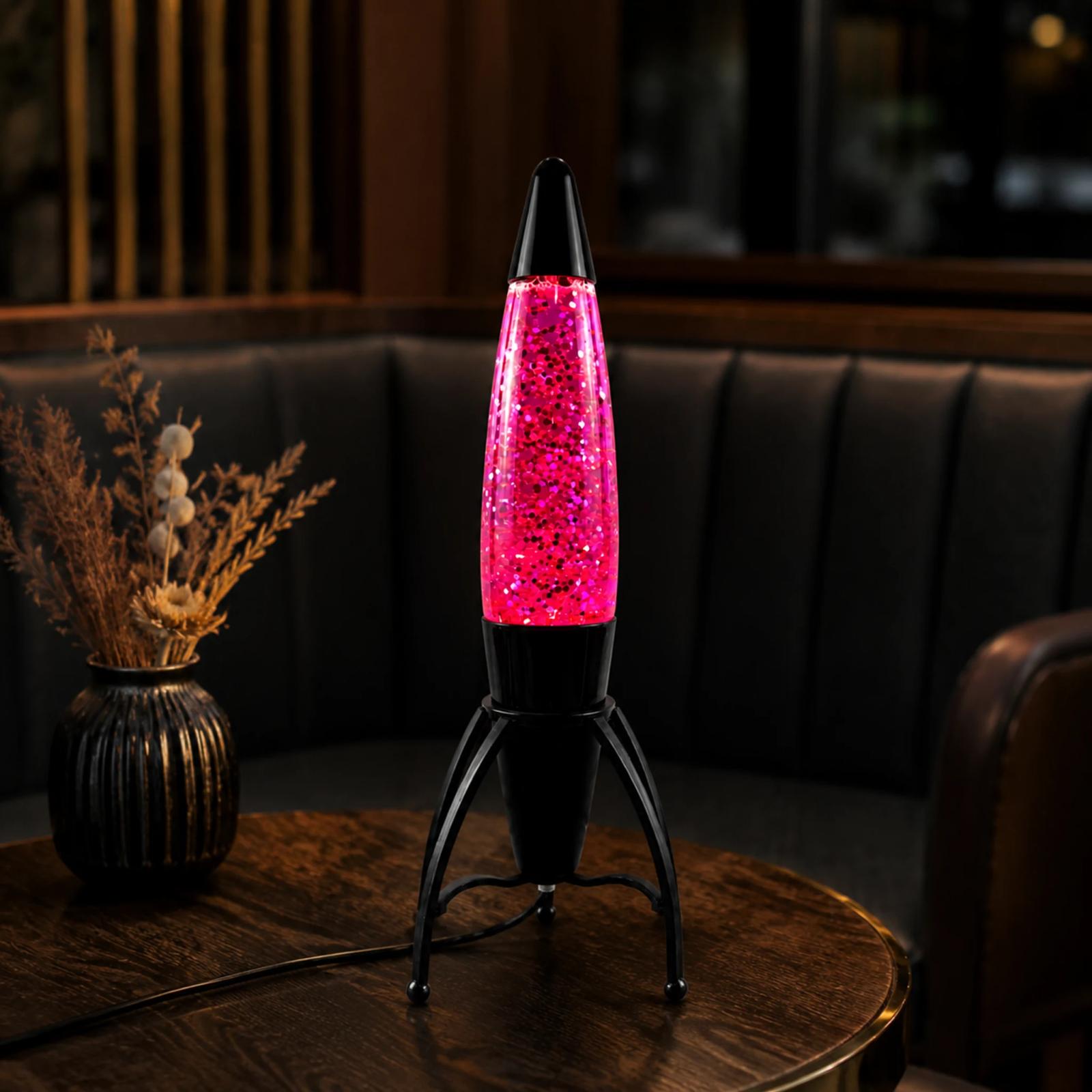 Pink MX-3060 rocket glitter lamp displayed in a modern cafe lounge