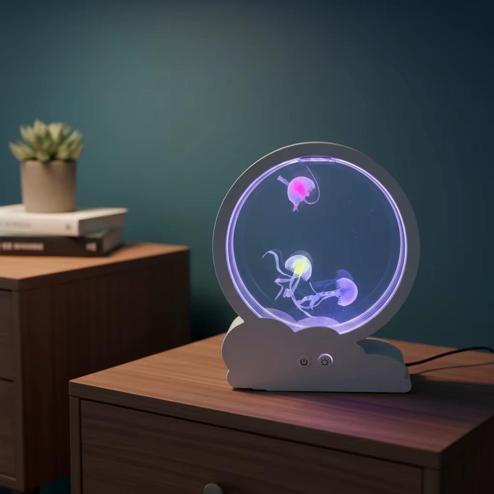 MX-5013C mini USB jellyfish aquarium night light glowing on a wooden desk with a dark teal wall background