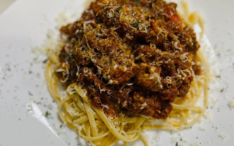 Bison bolognese over linguine