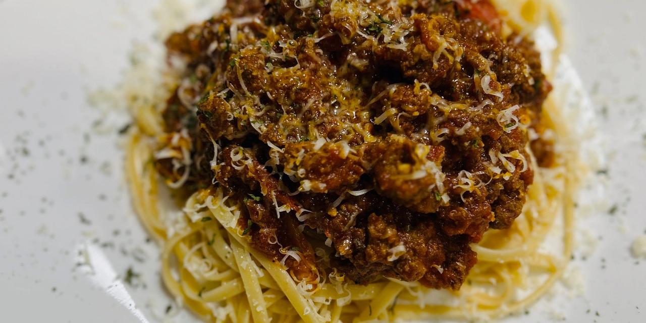 Bison bolognese over linguine