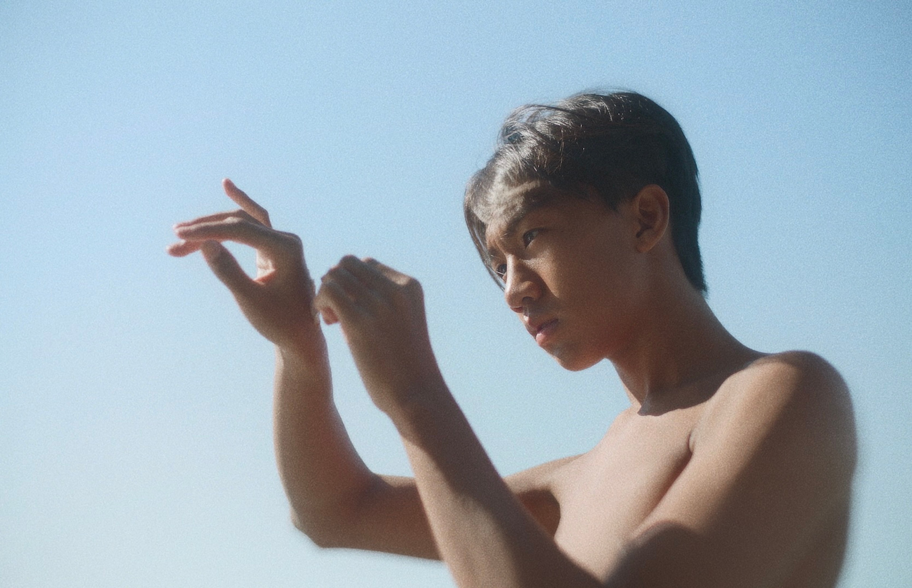 A person holding up their hands.