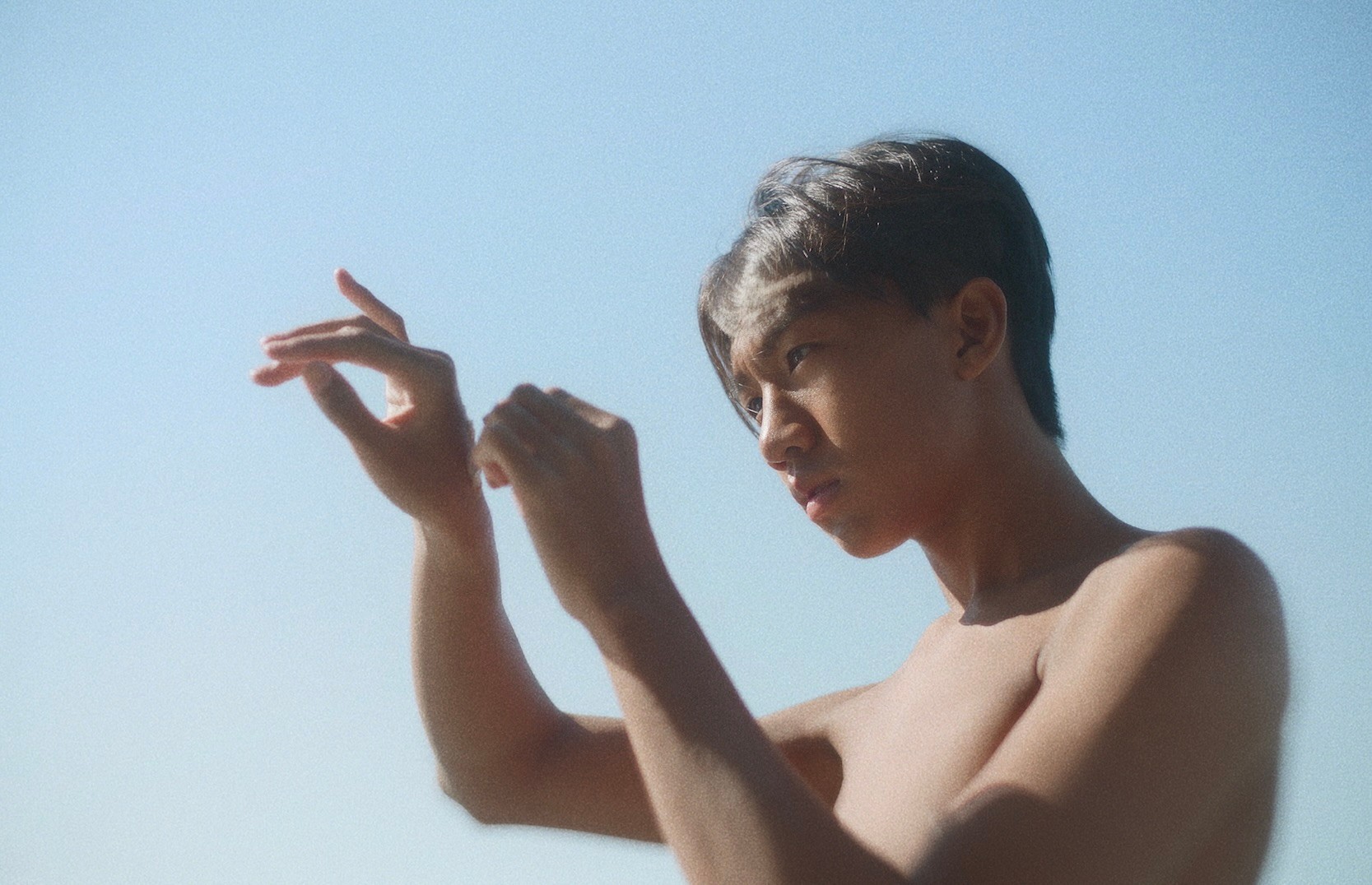 A person holding up their hands.