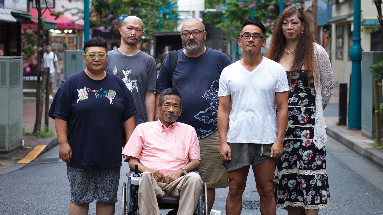 A group of six people pose for the camera.