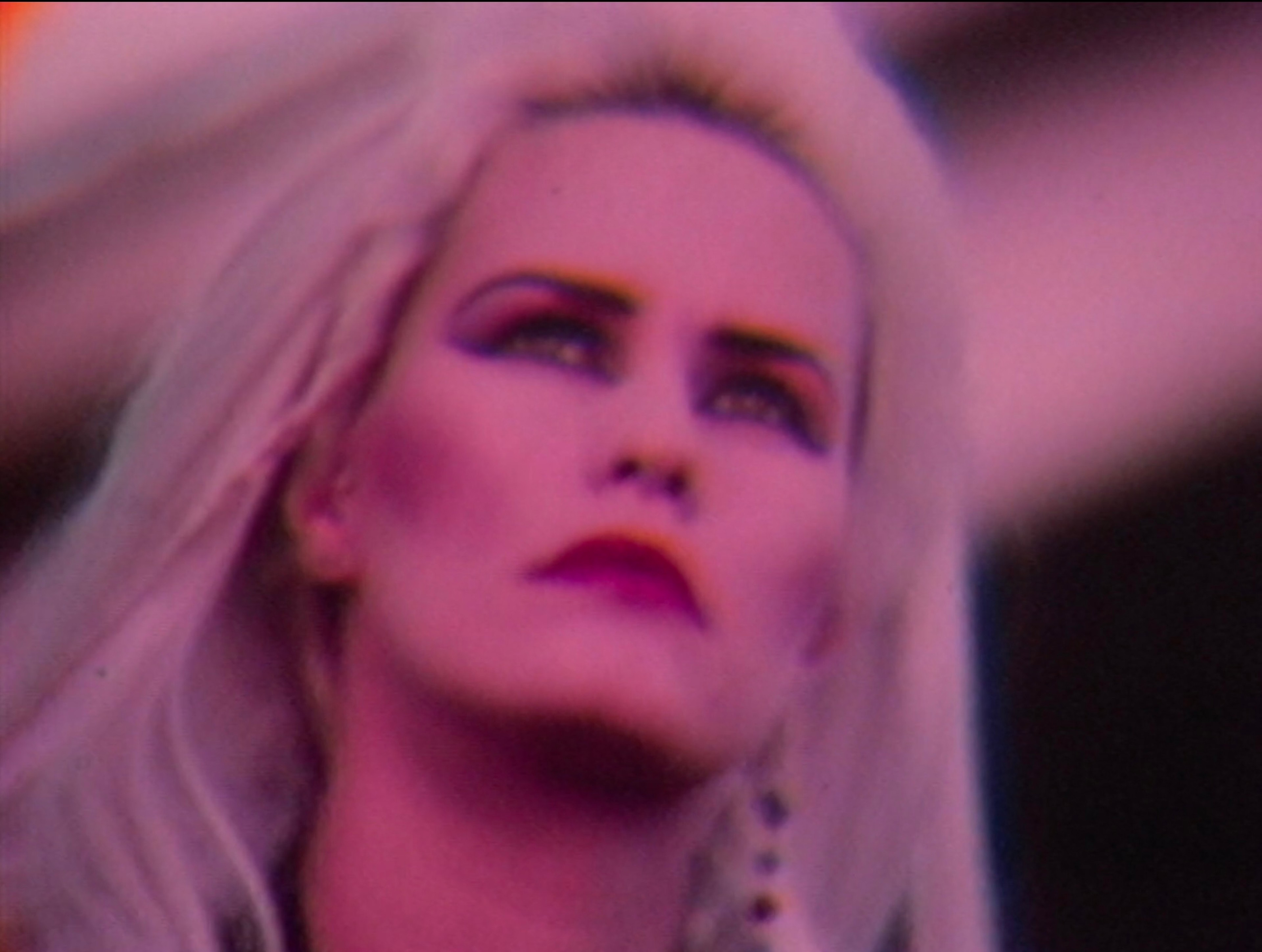 a blonde woman looks up.