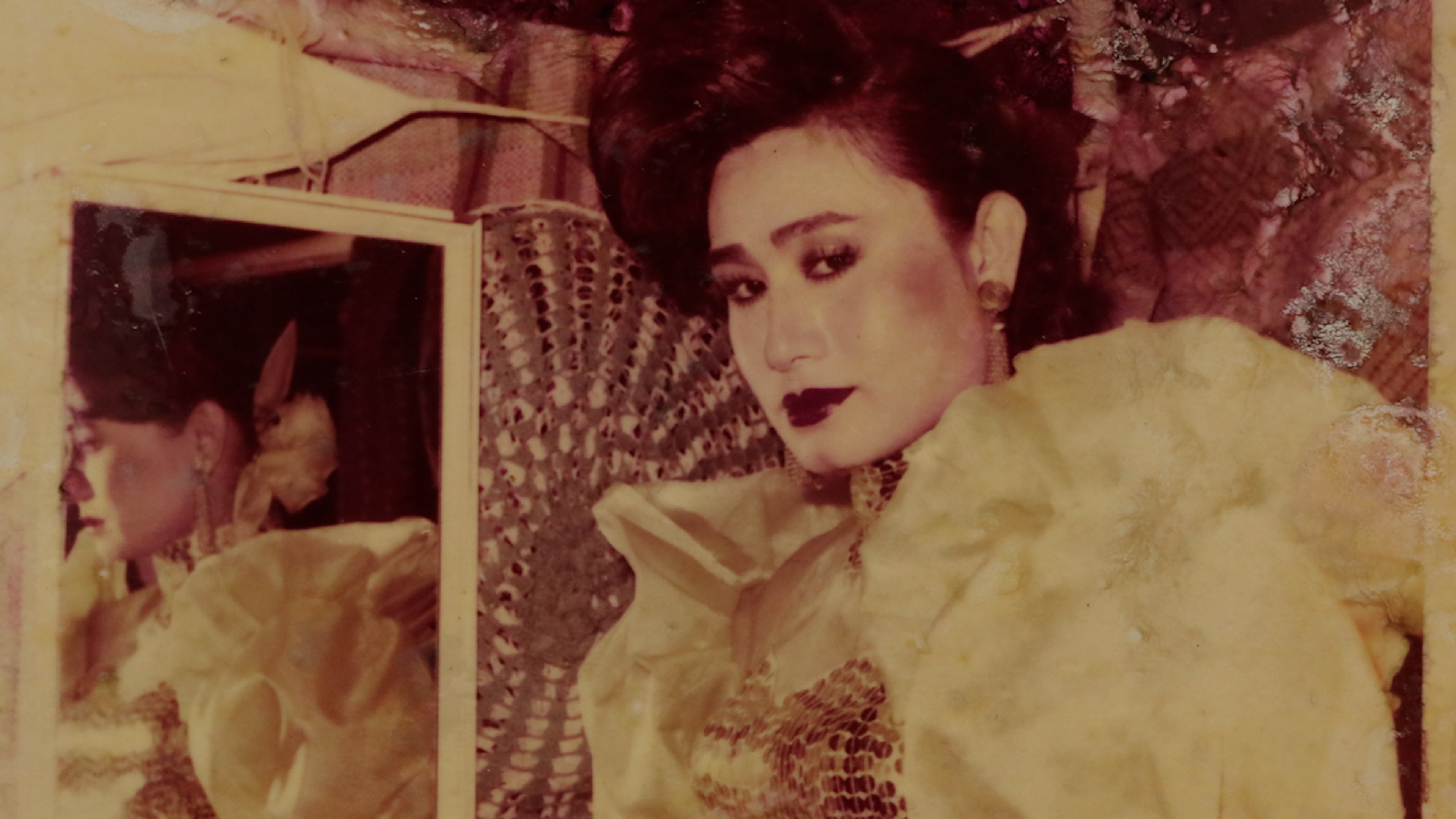 A sepia photograph of a person wearing ruffles