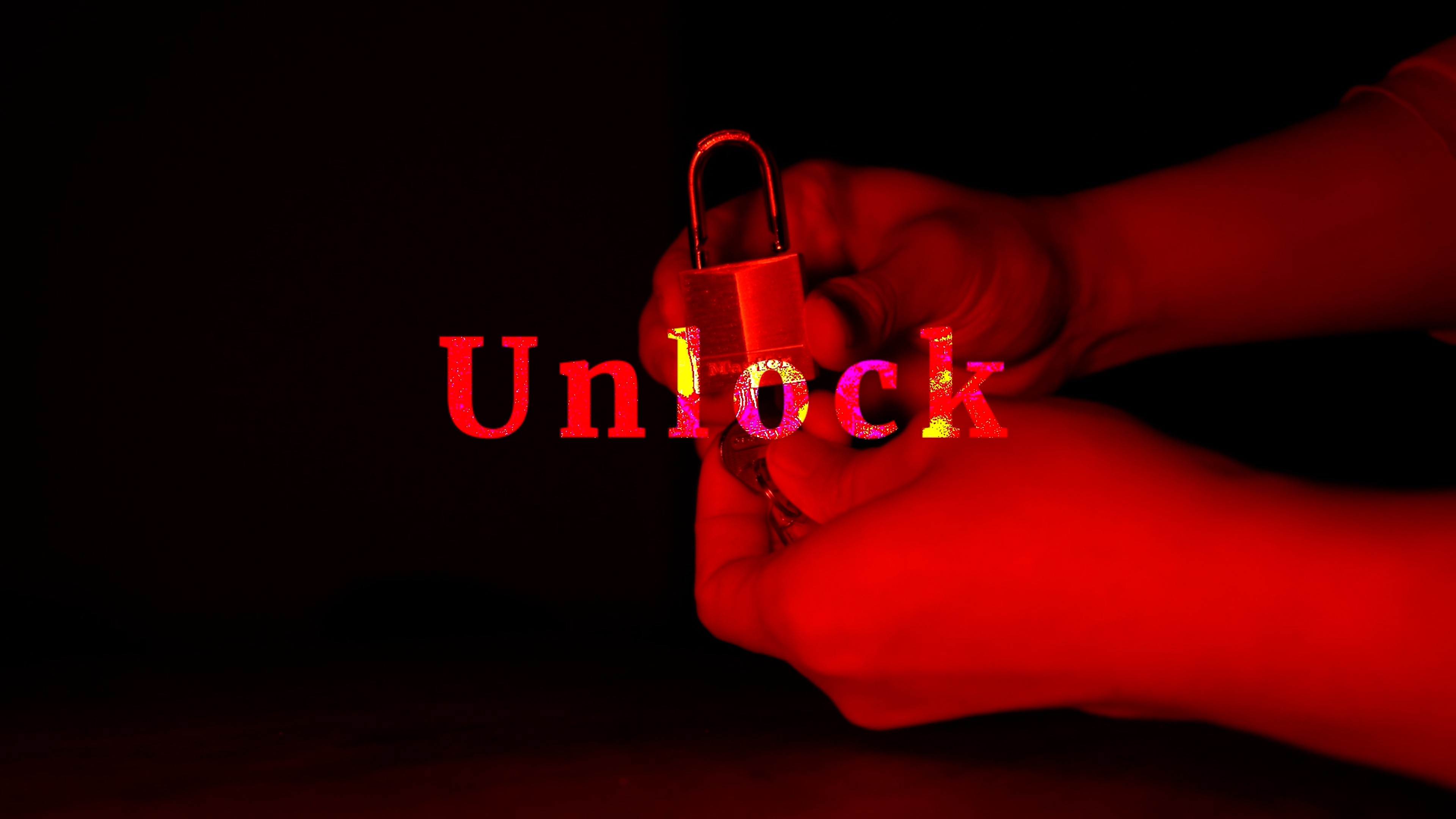 A pair of hands hold a lock.