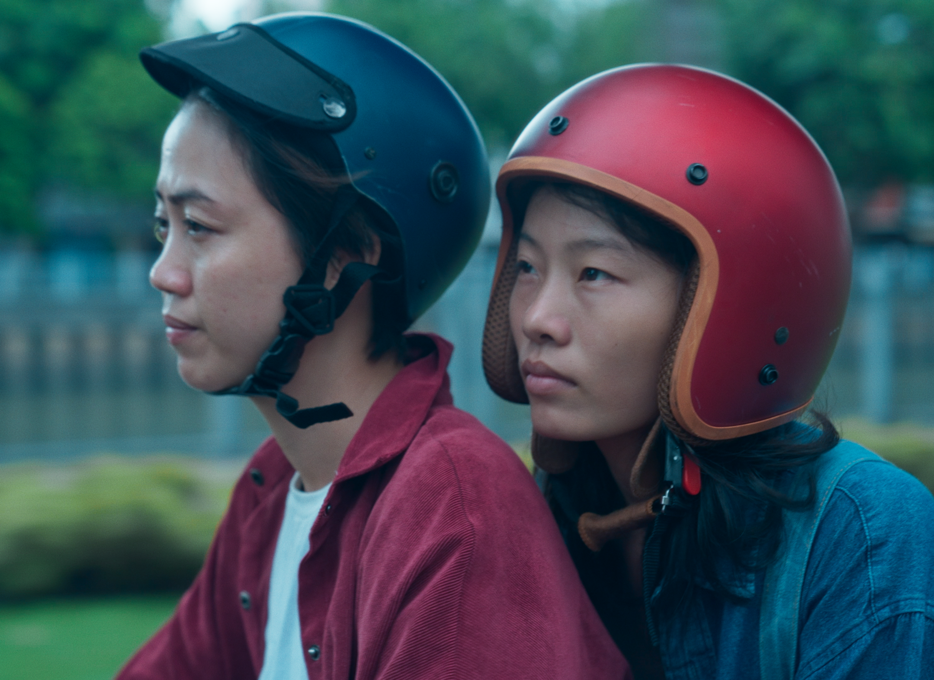 two women wearing helmets.
