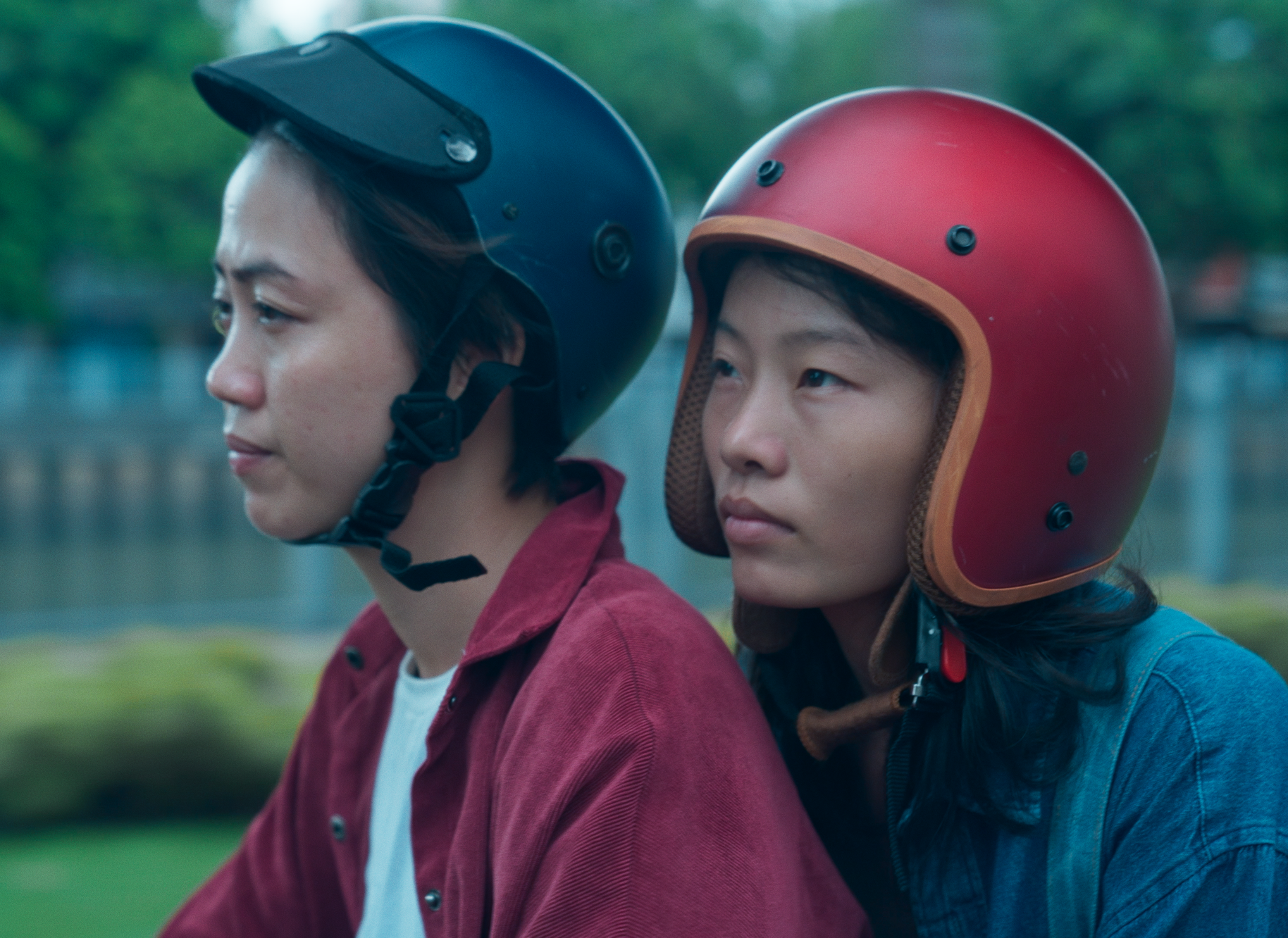 two women wearing helmets.