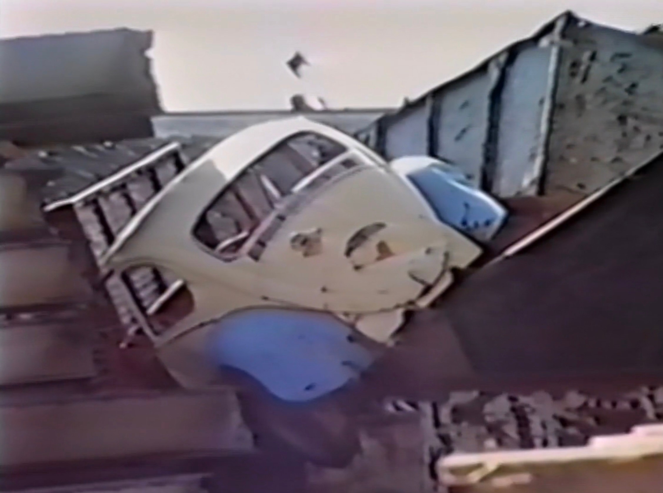 A car in a landfill.