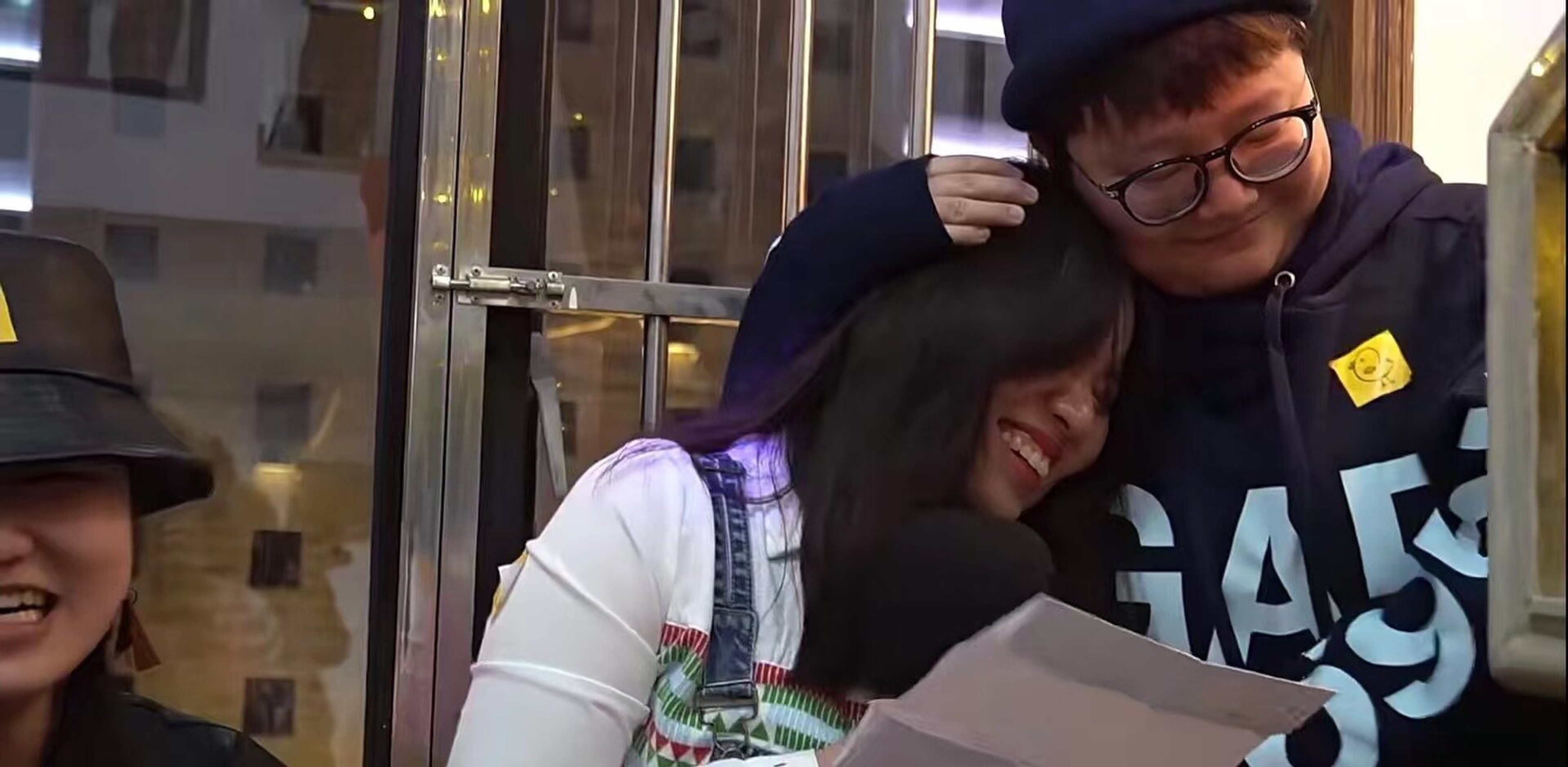 Two people embrace.