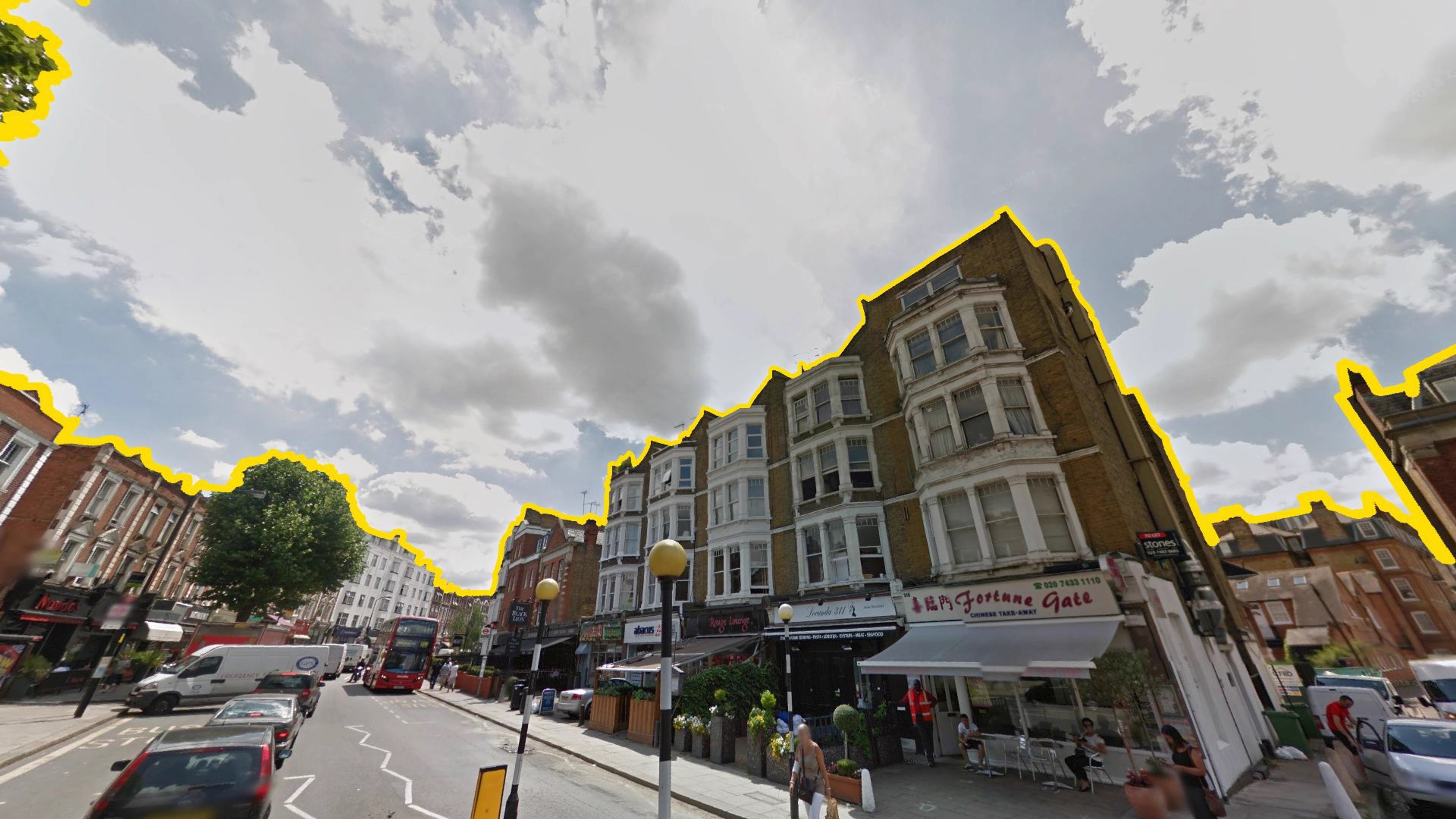 A row of buildings outlined in yellow.