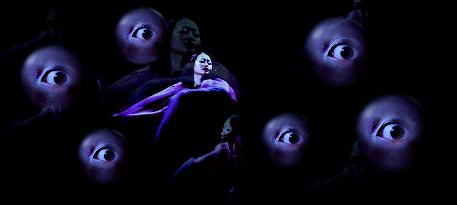 A dark, surreal composition of floating eyes surrounding overlapping figures illuminated in purple light.