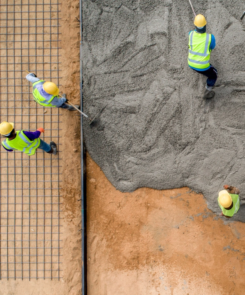 Workers mixing cement