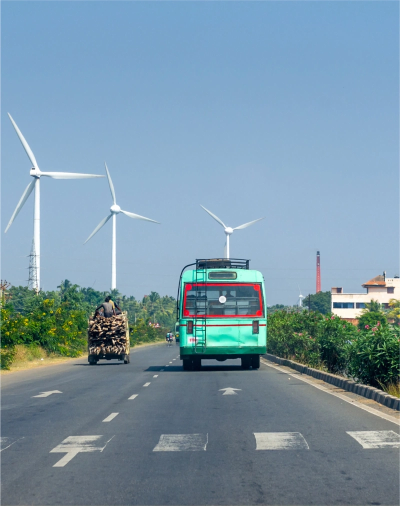 Wind turbines overlooking a rural road