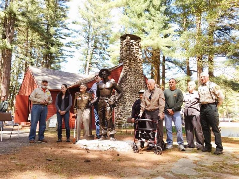 A life-size bronze CCC Worker Statue at a Colorado park