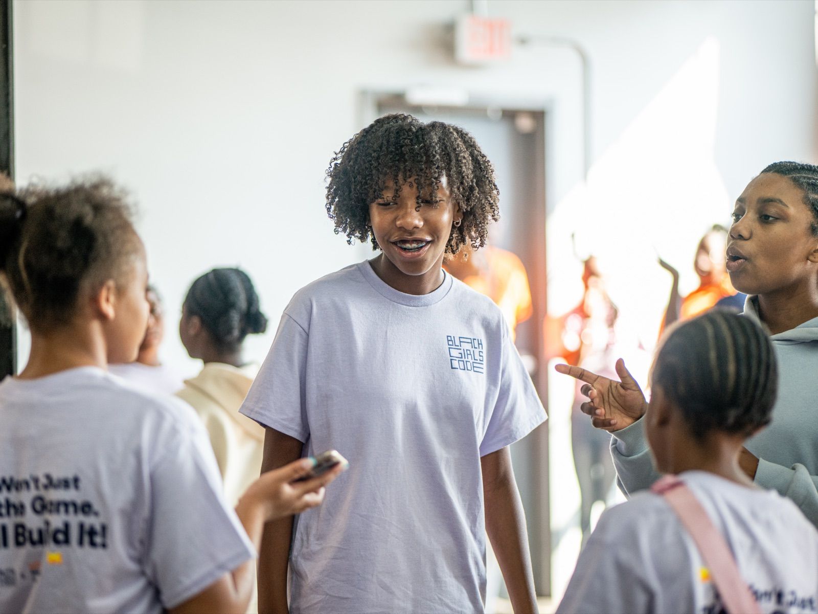 Morgan, 12, talking with other girls at Black Girls Code camp