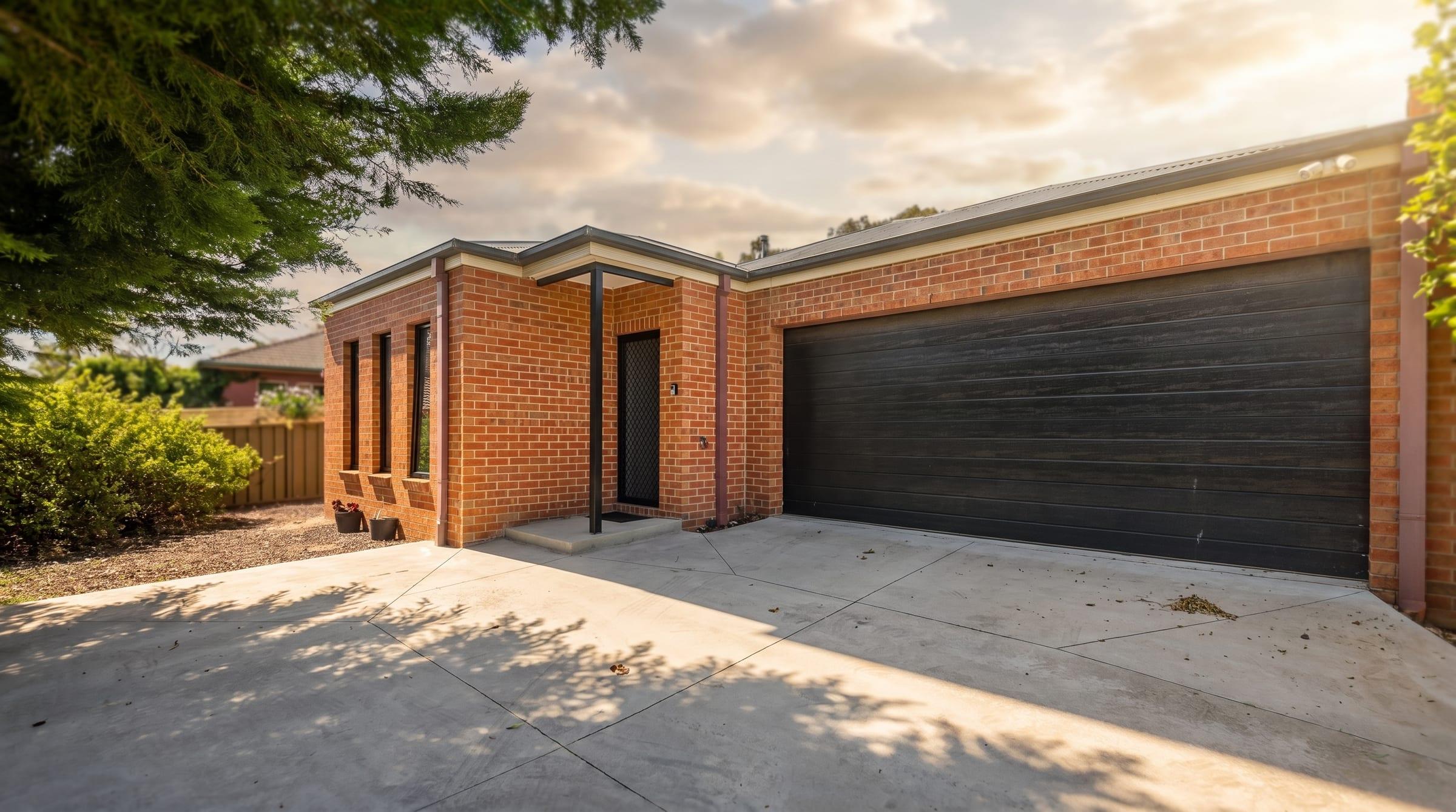 Front exterior of Strathdale McIvor, an NDIS Supported Independent Living home provided by Myxa — captured in warm late-afternoon light with editorial real-estate photography quality.