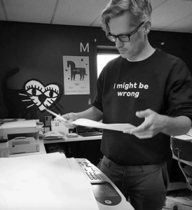 A portrait of Benjamin Hickethier in the print shop