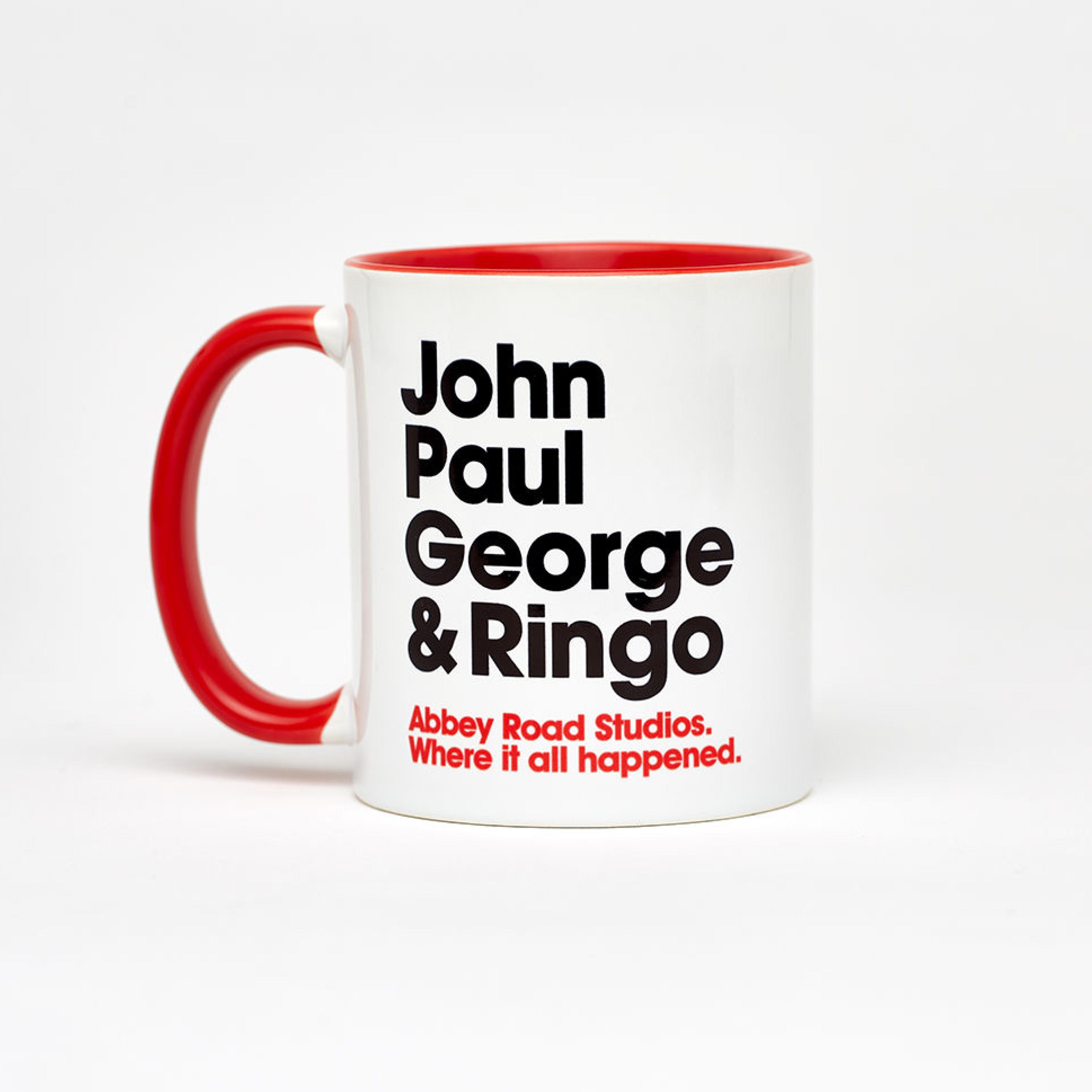Beatles Mug A white mug with red handle, contains the words "John Paul George & Ringo."