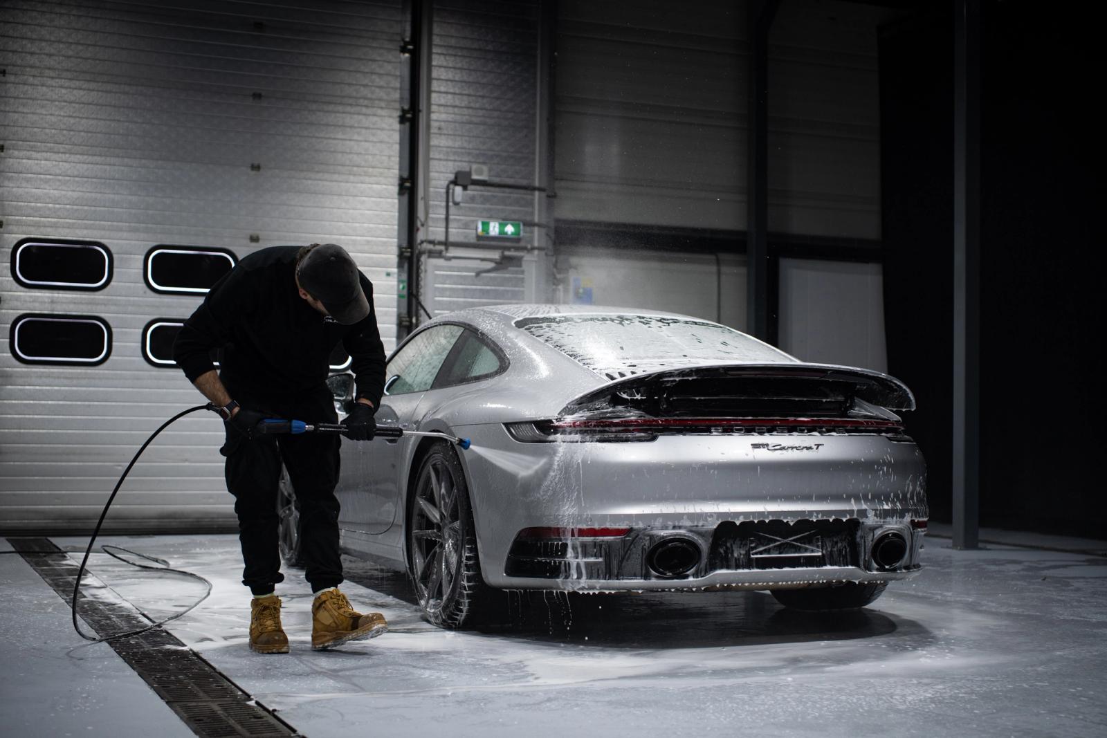 Porsche 911 being hand washed in the Charlie Detailing studio in Utrecht