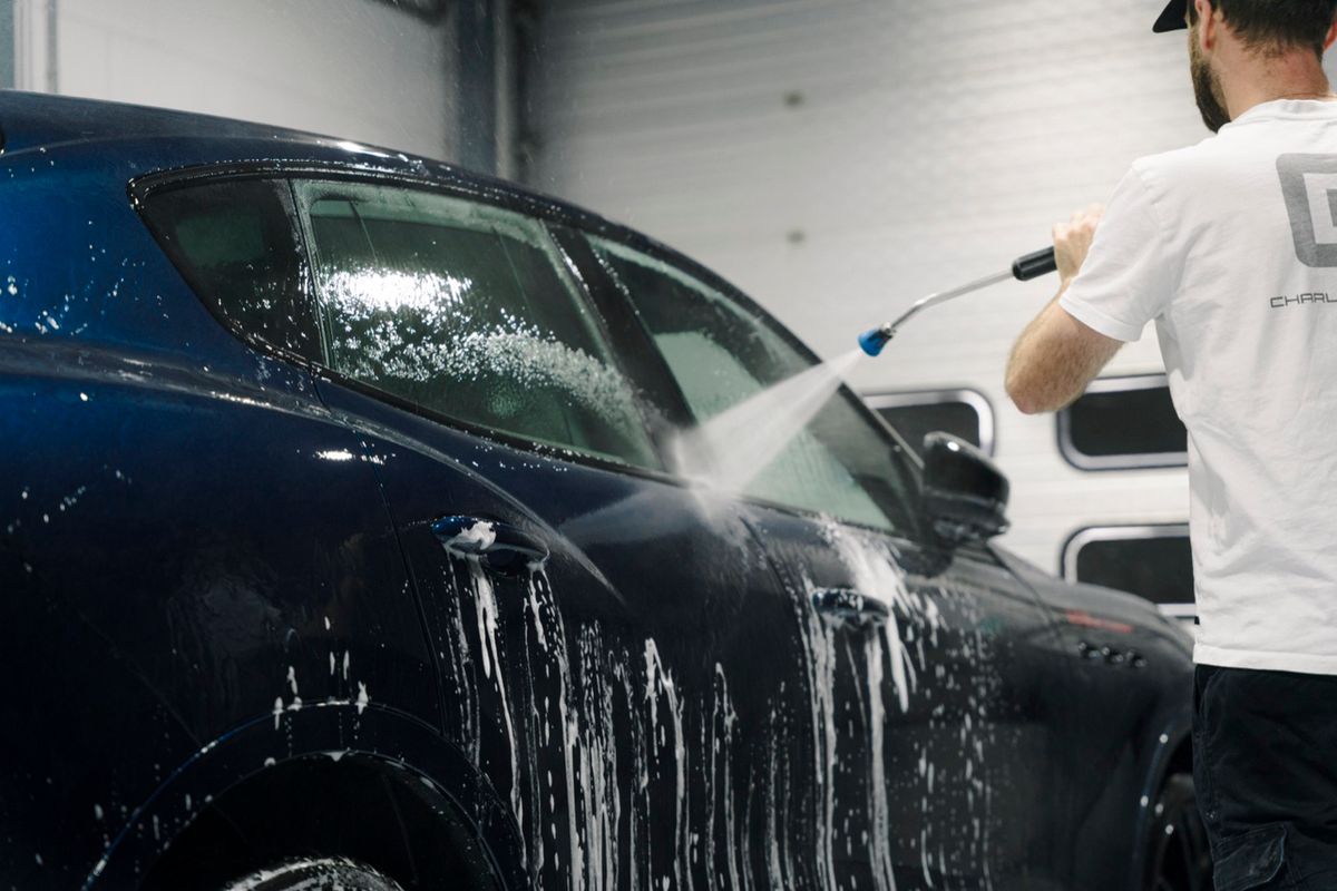Maserati Levante being pre-rinsed during a maintenance visit at Charlie Detailing