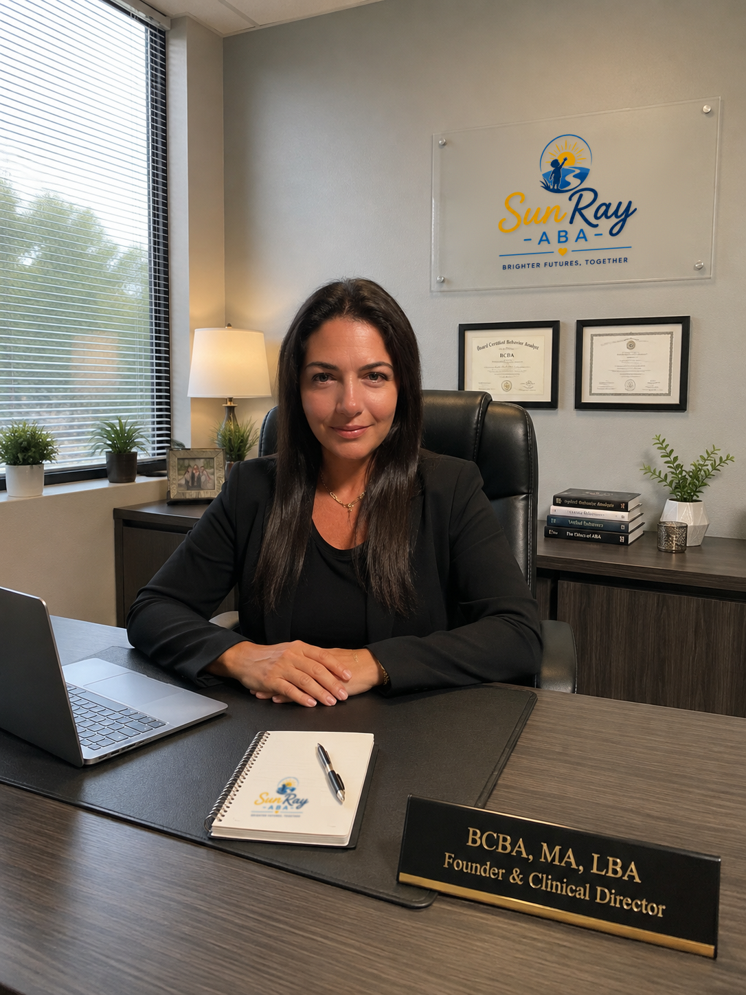 Rachel, SunRay ABA's founder and clinical director, at her desk
