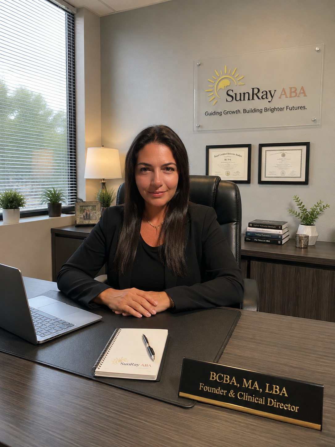 Rachel, SunRay ABA's founder and clinical director, at her desk