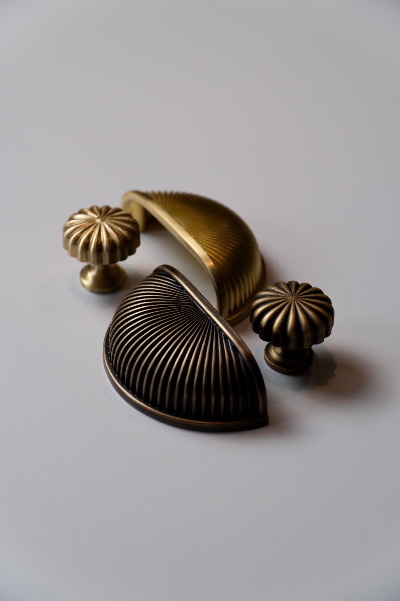 Shell-shaped brass cabinet knobs, detail still