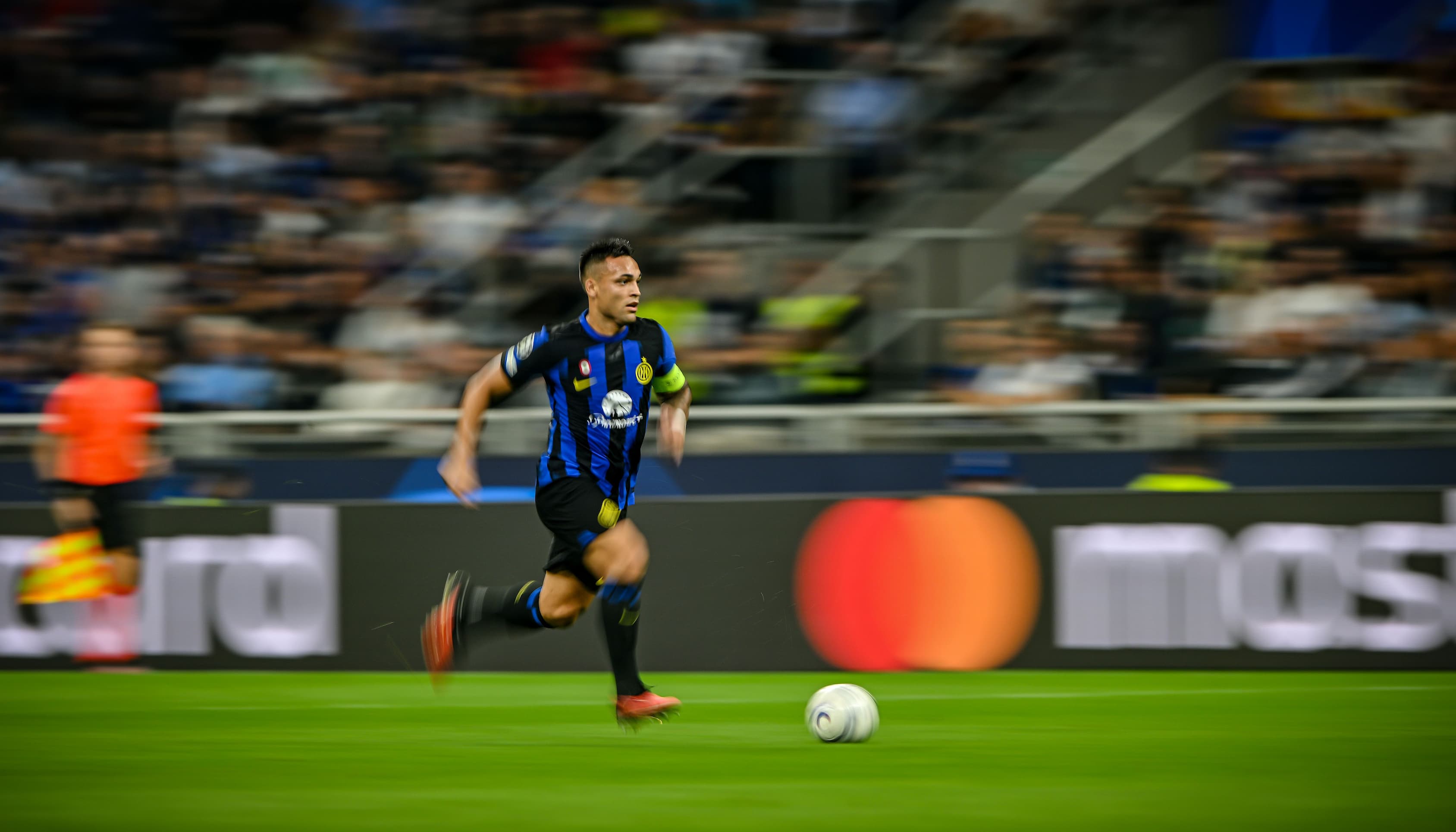 footballer running with ball