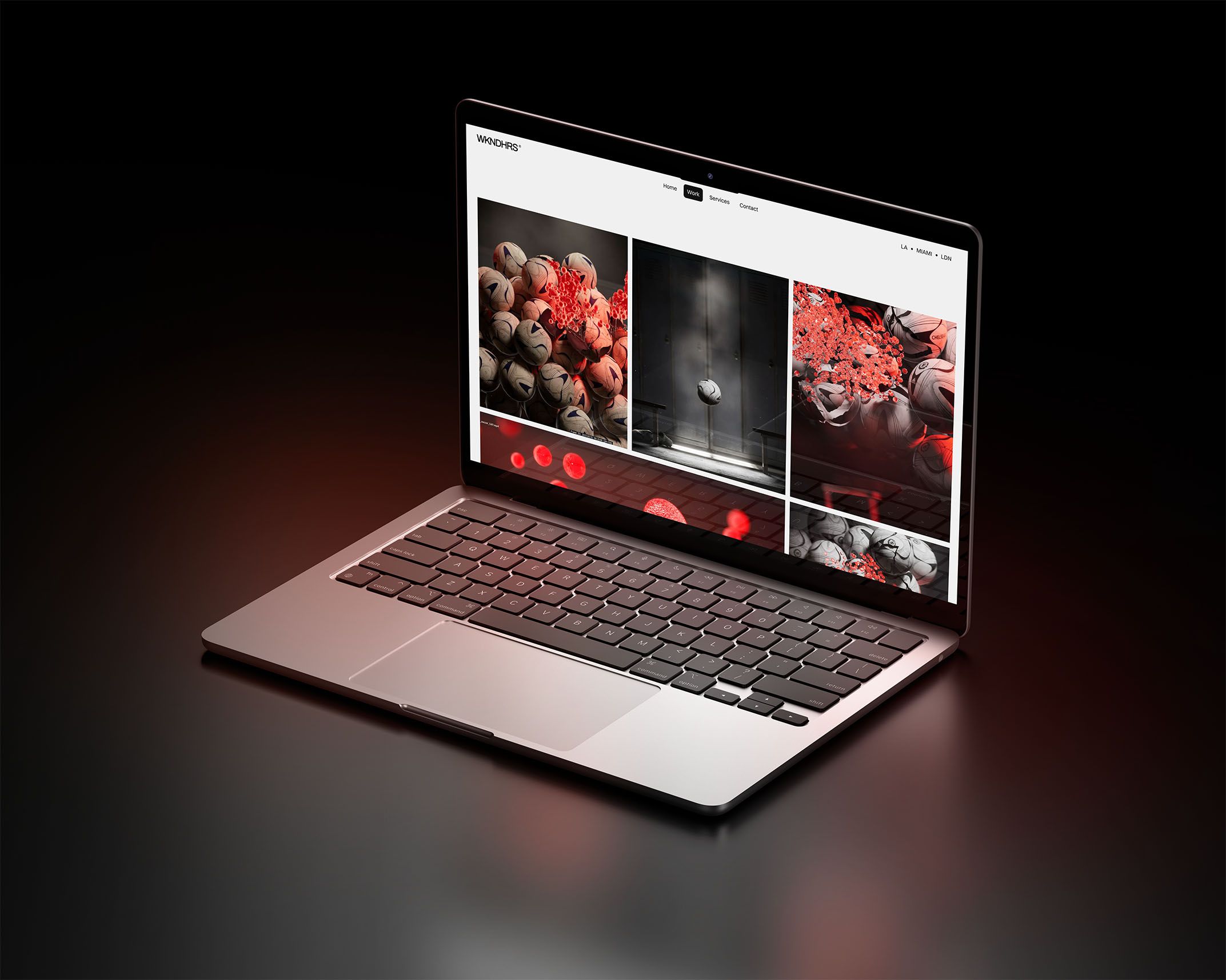 WKNDHRS portfolio website displayed on a laptop, featuring a grid-based gallery of immersive visual projects with bold red accents on a dark background