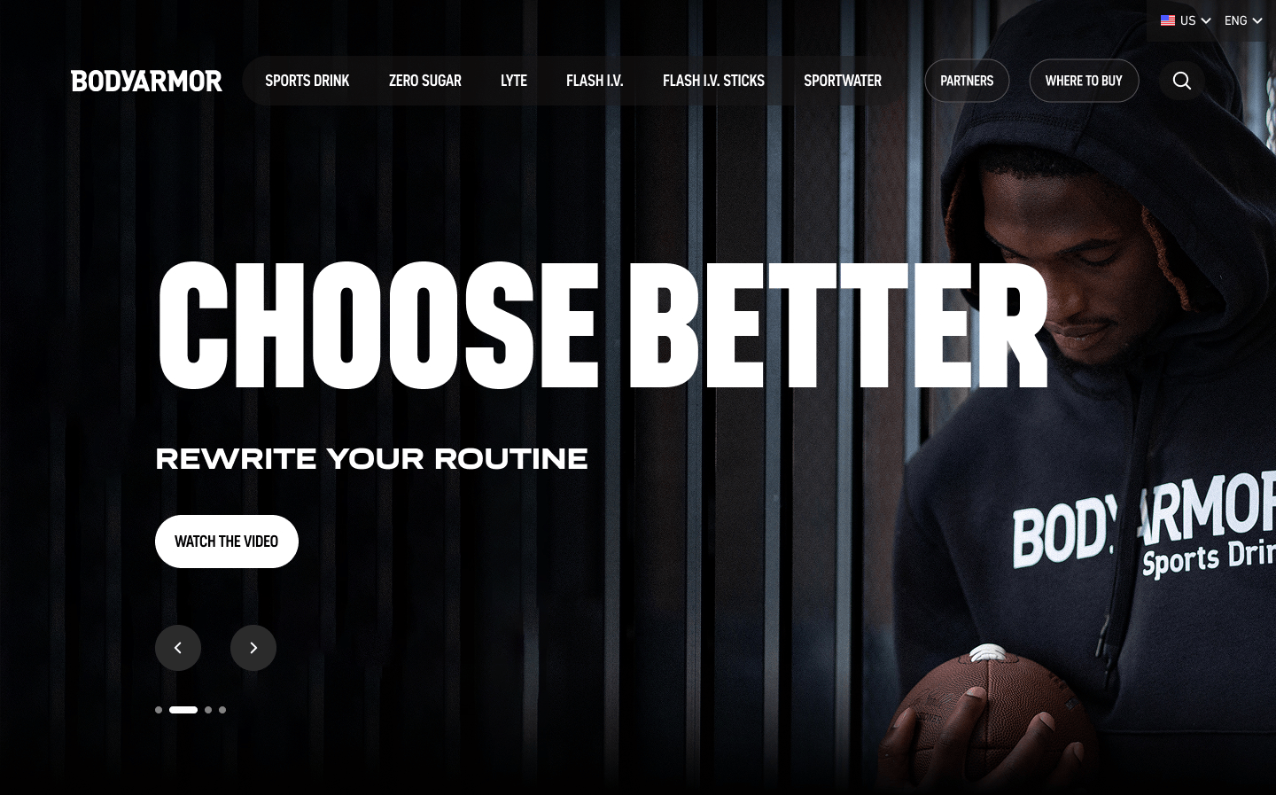 Bodyarmor homepage hero featuring an athlete holding a football with the headline “Choose Better” and call-to-action to watch the brand video