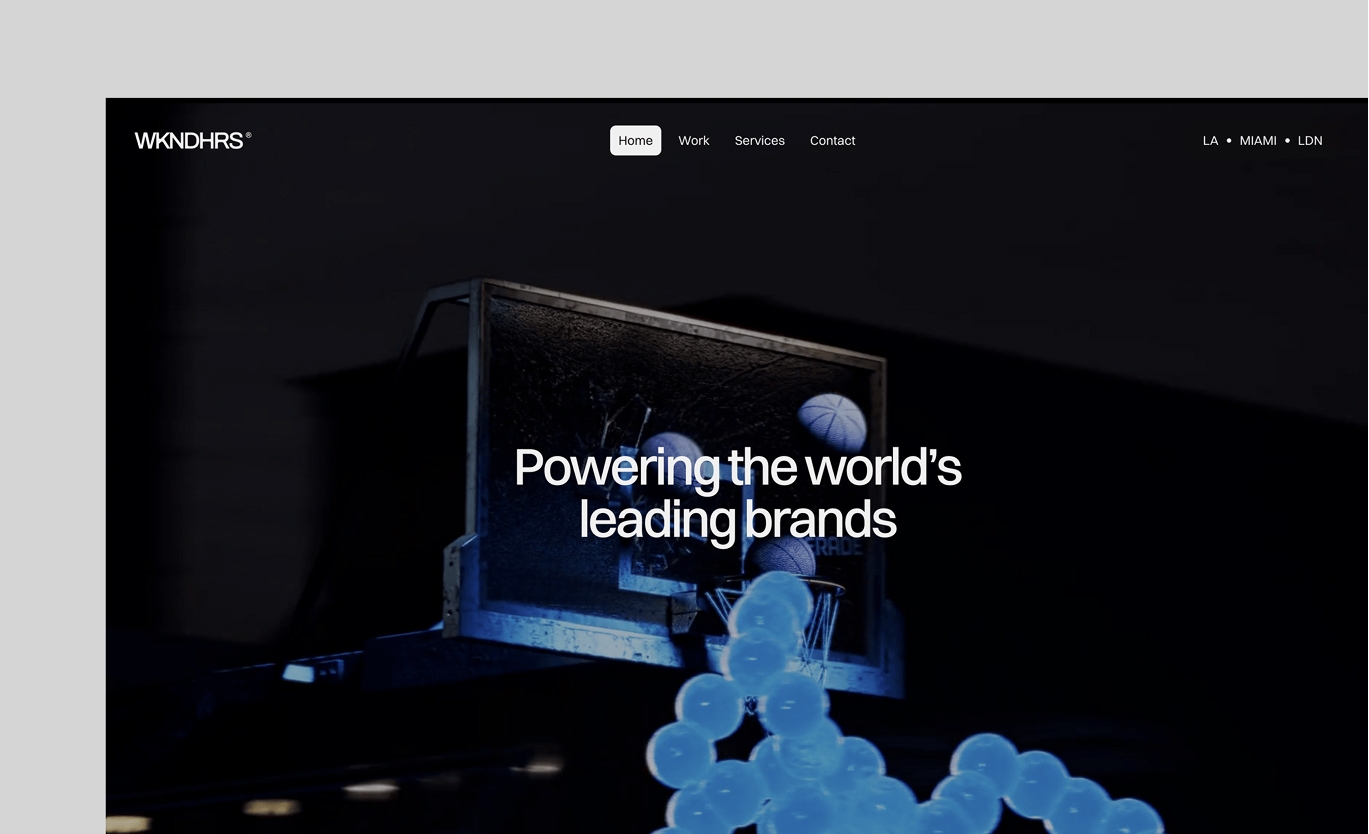WKNDHRS website hero featuring a basketball hoop installation with glowing blue spheres and the headline “Powering the world’s leading brands”