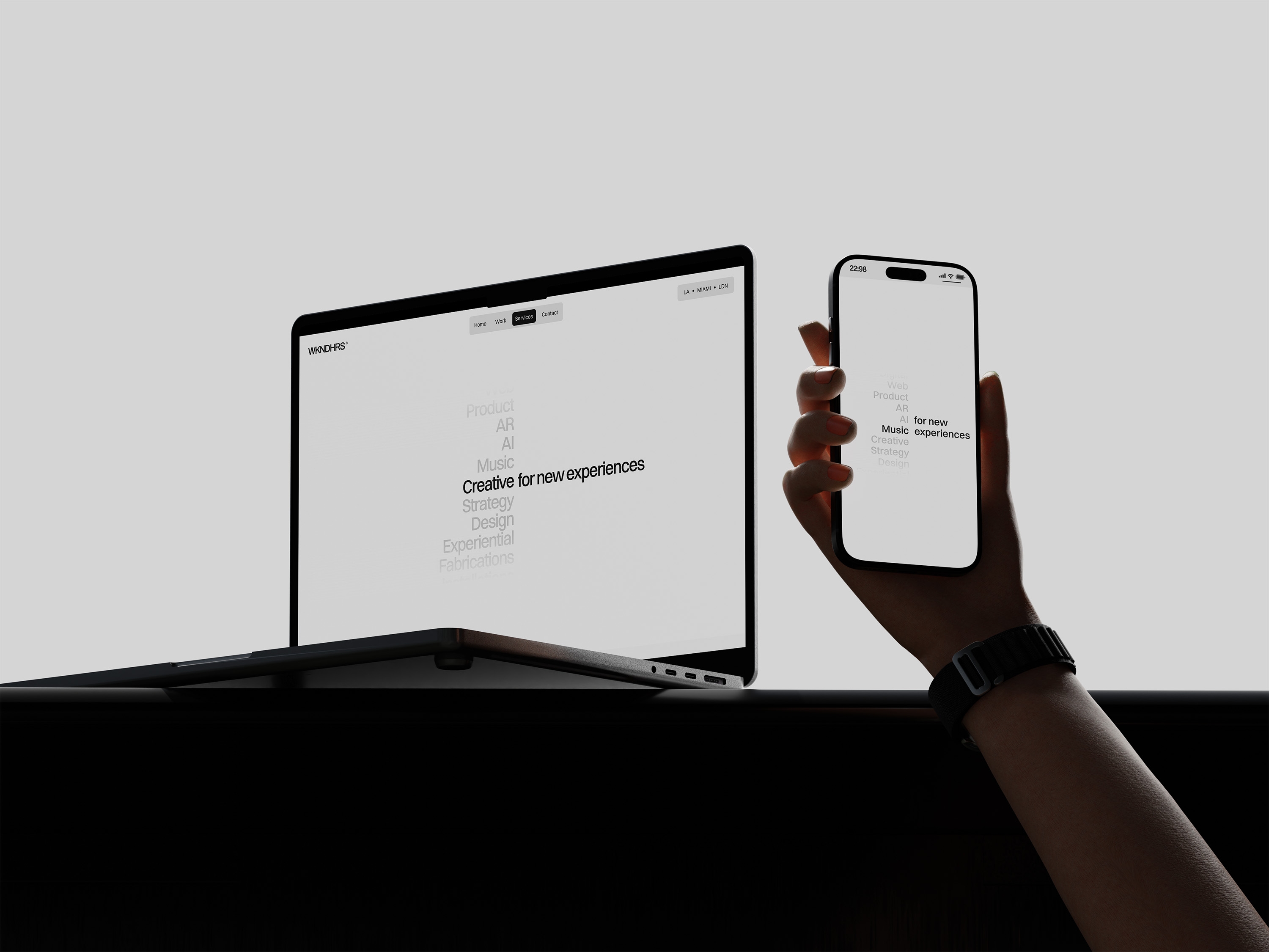 WKNDHRS website displayed across laptop and mobile, highlighting creative services for AI, AR, music, and new digital experiences in a minimalist interface