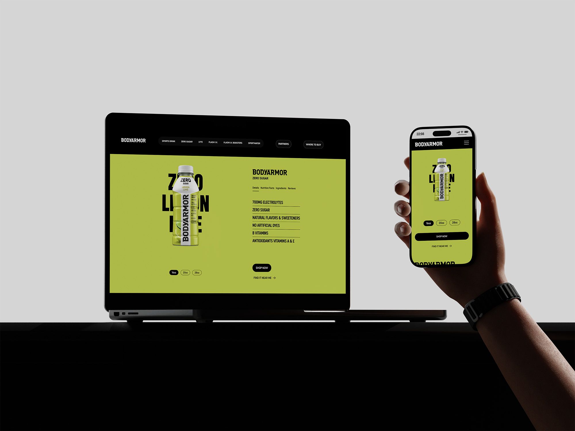 Laptop and smartphone displaying the Bodyarmor Zero Sugar product page with consistent branding and a bold green interface across desktop and mobile